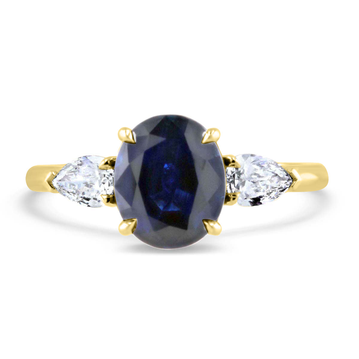 Darling Sapphire and Pear Shape Three Stone Ring