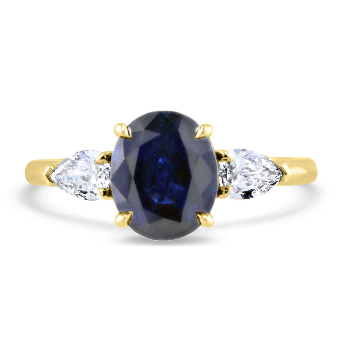 Darling Sapphire and Pear Shape Three Stone Ring