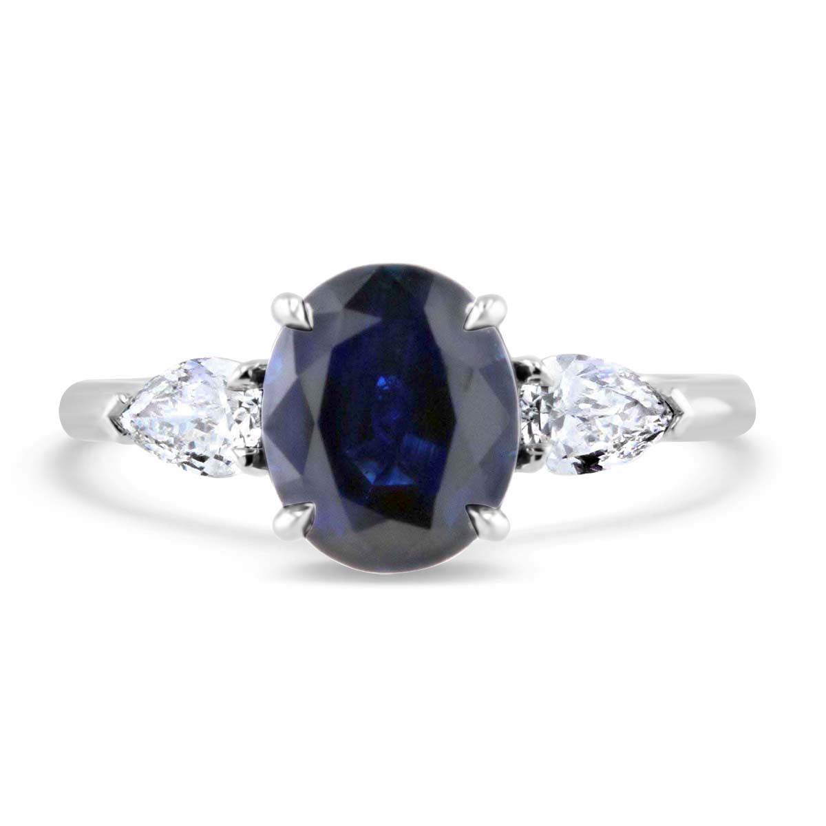 Darling Sapphire and Pear Shape Three Stone Ring