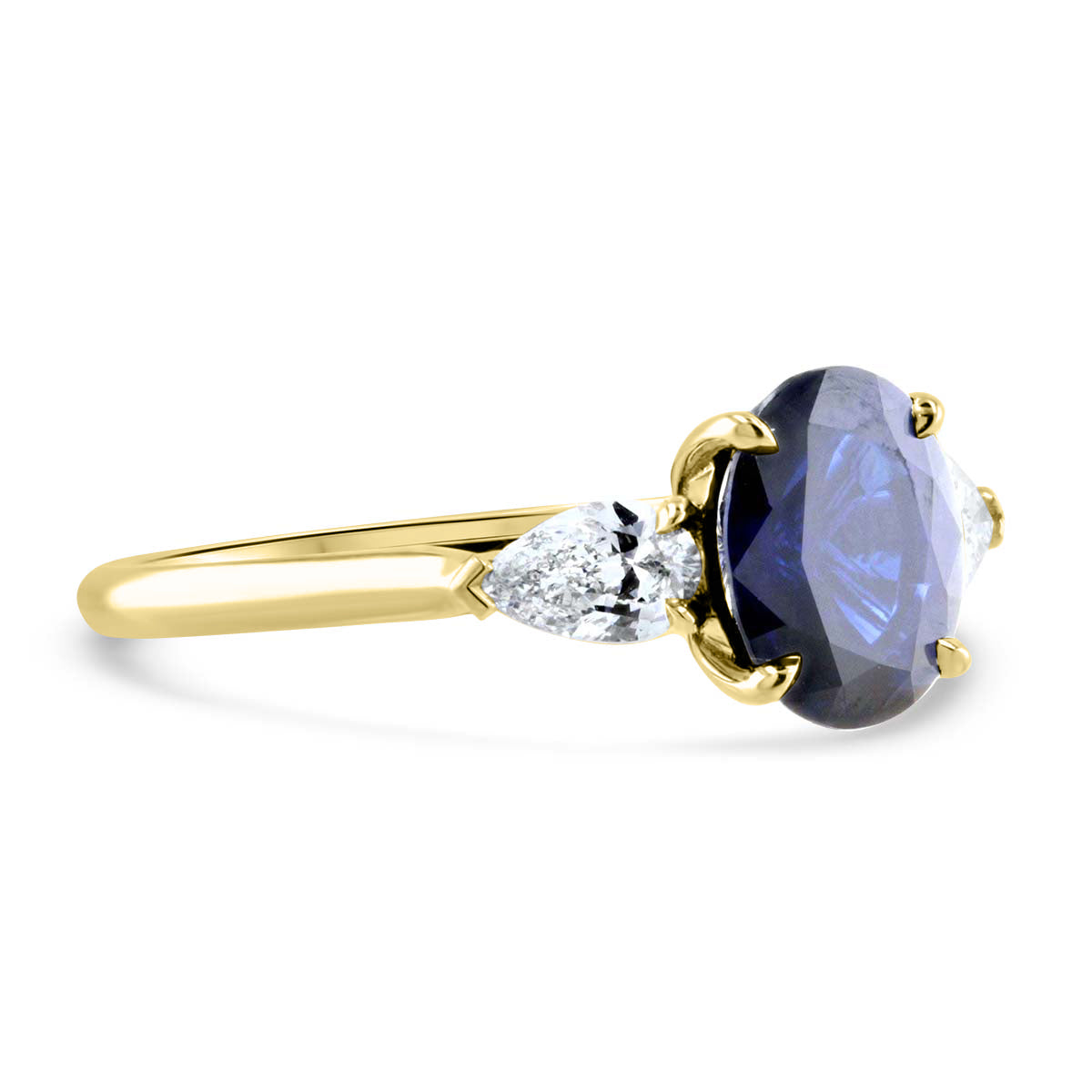 Darling Sapphire and Pear Shape Three Stone Ring