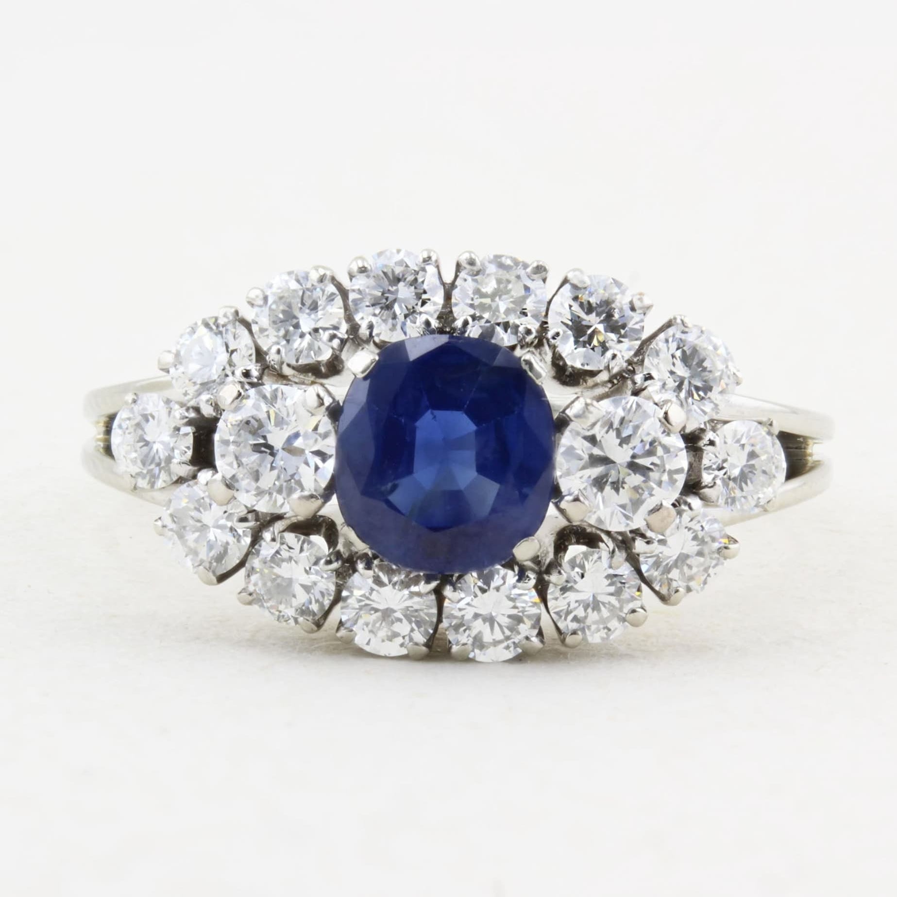 Vintage Natural Sapphire Cluster Ring in white gold on a white background