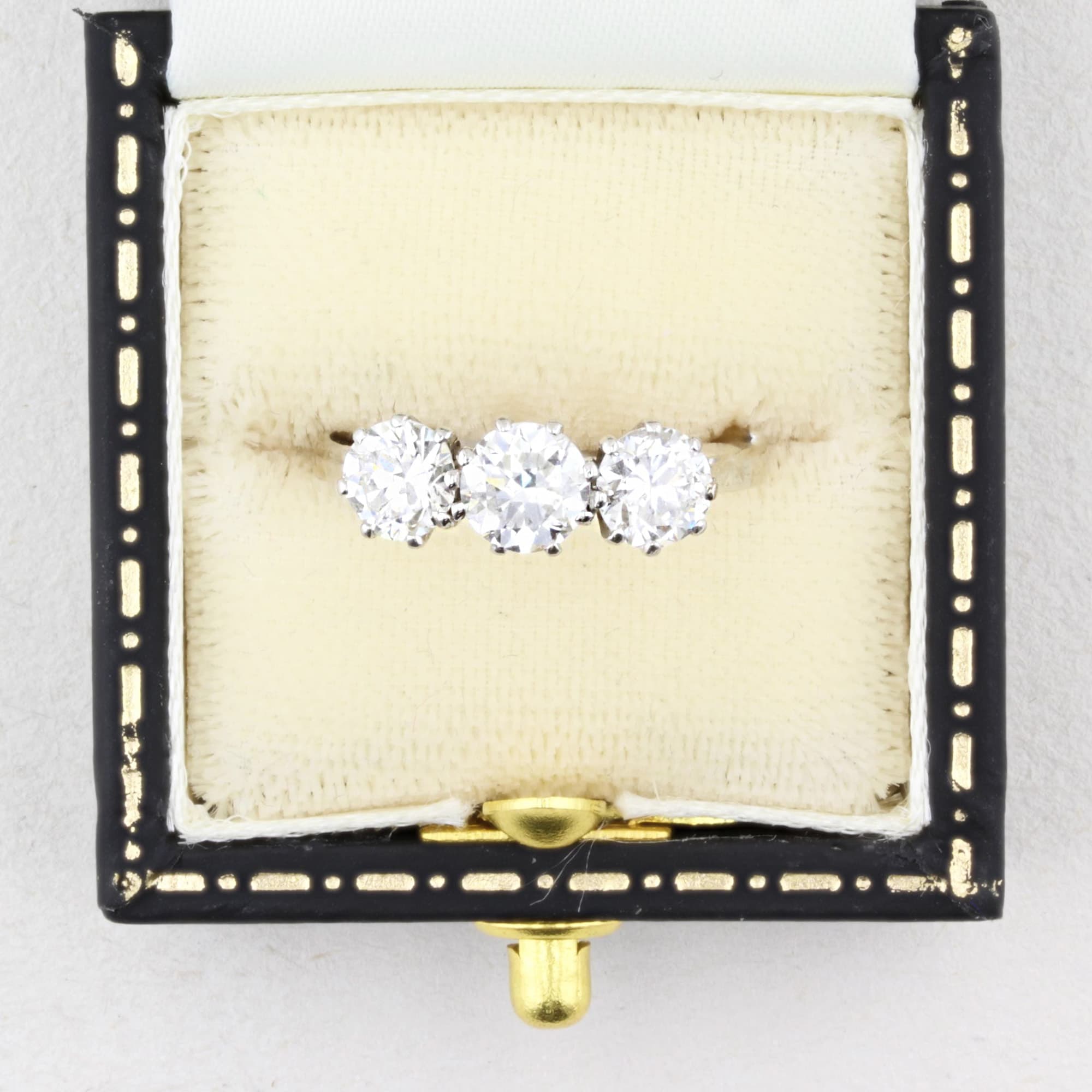 three stone old cut  diamond ring in a vintage box