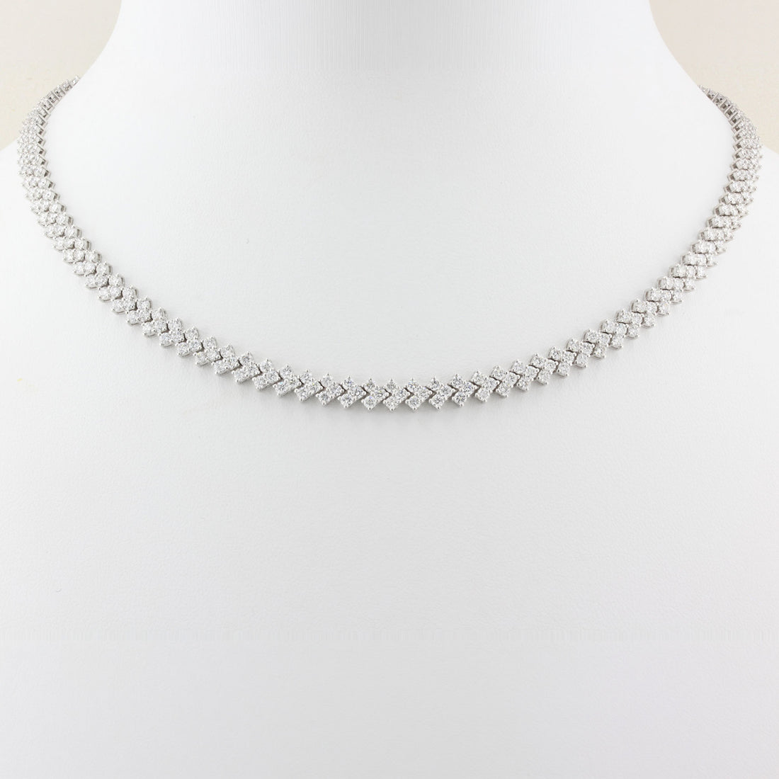 white gold tennis necklace on a white background