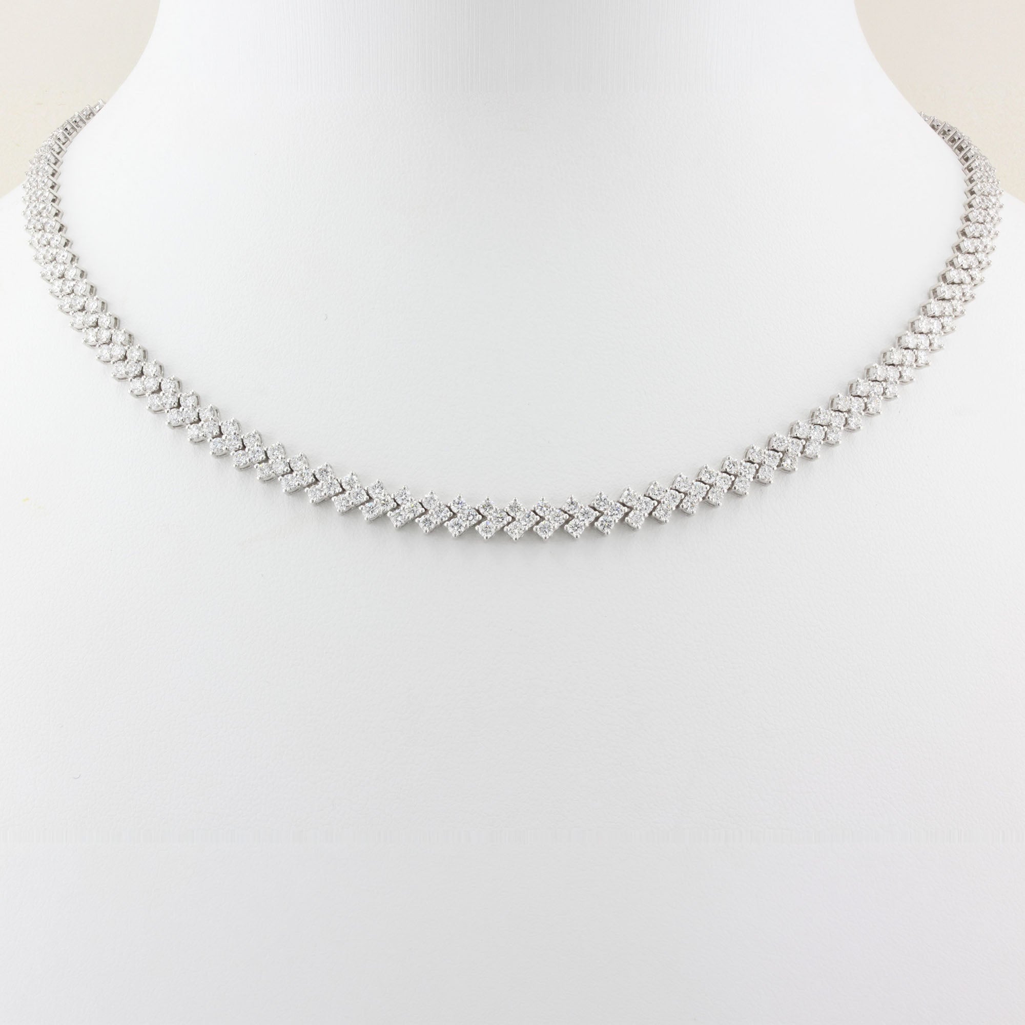 white gold tennis necklace on a white background