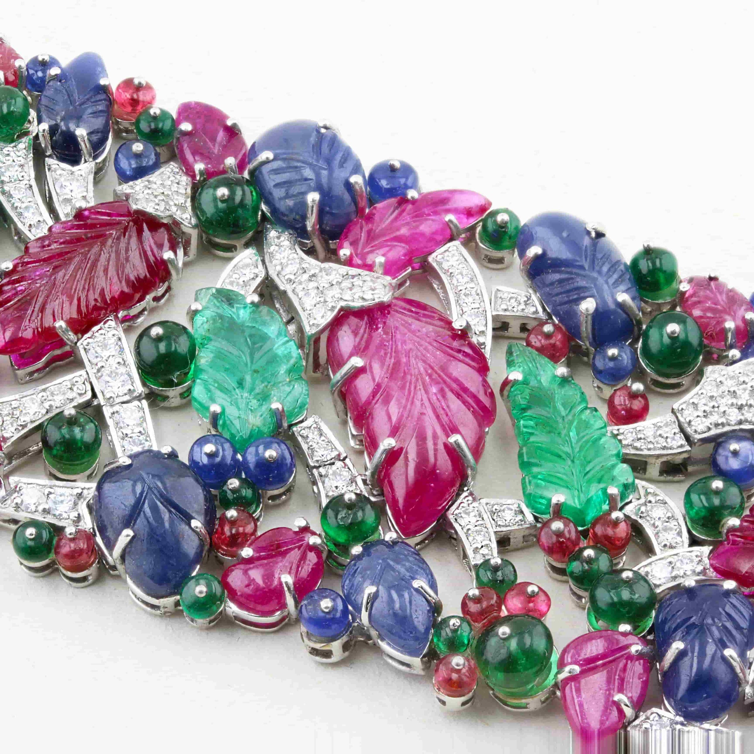 Colorful gemstone bracelet with various stones on a white background